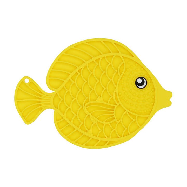 Yellow silicone lick mat shaped like a fish, with a textured ridged surface and a hanging hole in the tail.