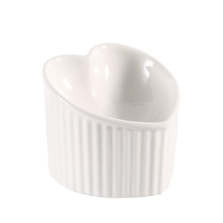 White ceramic bowl with a fluted, ribbed exterior and a heart-shaped rim.