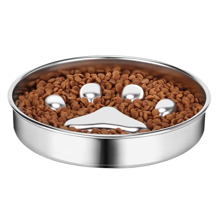 Round stainless steel pet bowl with a raised paw-shaped centre divider, filled with kibble.