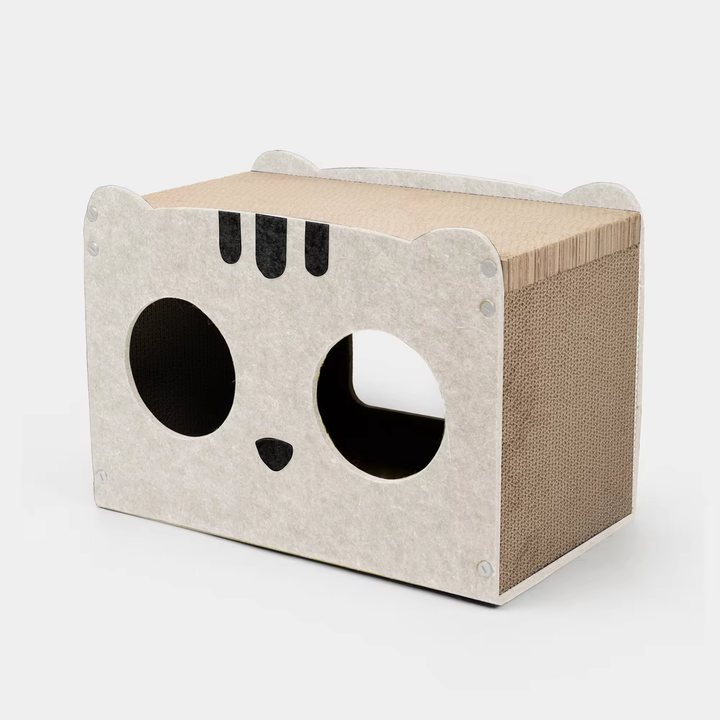 Beige felt cat-face-shaped house with round eye-hole openings and a corrugated cardboard scratch top.
