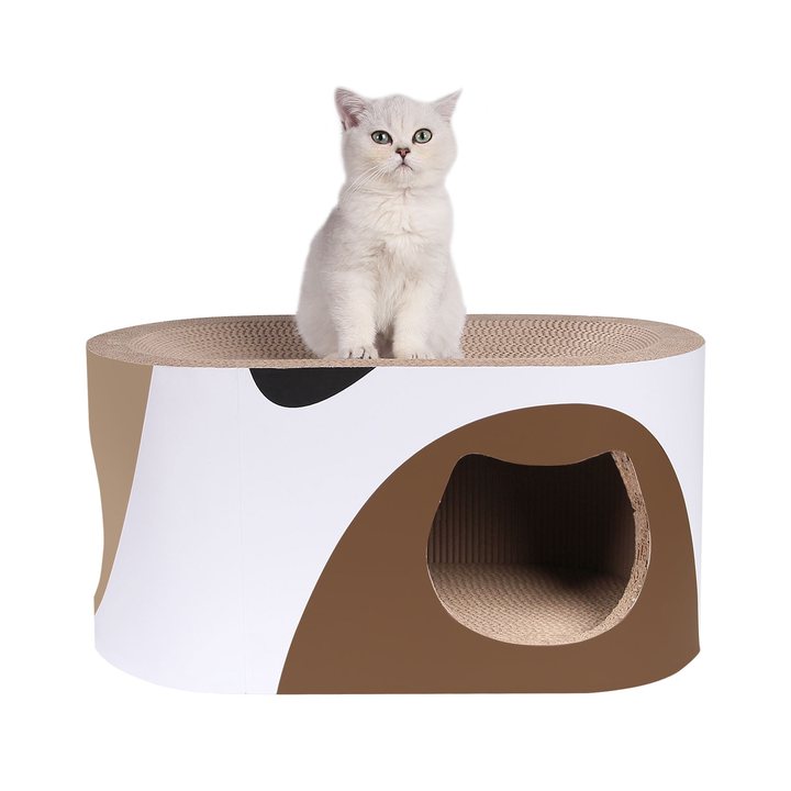 Oval capsule-shaped corrugated cardboard cat lounge in a tan and white patchwork print with a cat-face-shaped entrance cut-out.