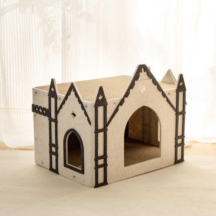 Cream felt gothic-castle-shaped cat house with dark grey trim, twin corner spires, and arched entrances.