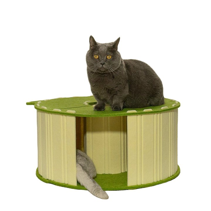 Round green and cream felt cat house with a ribbed side wall and top ventilation hole