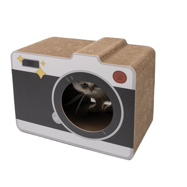Camera-shaped cardboard cat scratcher house with a round lens entrance