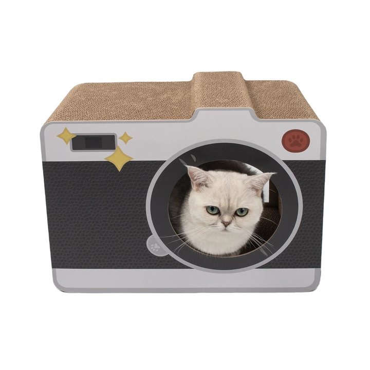 Camera-shaped cardboard cat scratcher house with a round lens entrance, front view