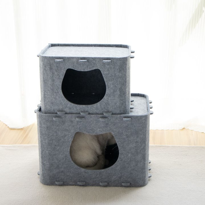 Two gray felt box cat houses stacked, each with a cat-head-shaped doorway cut into the front