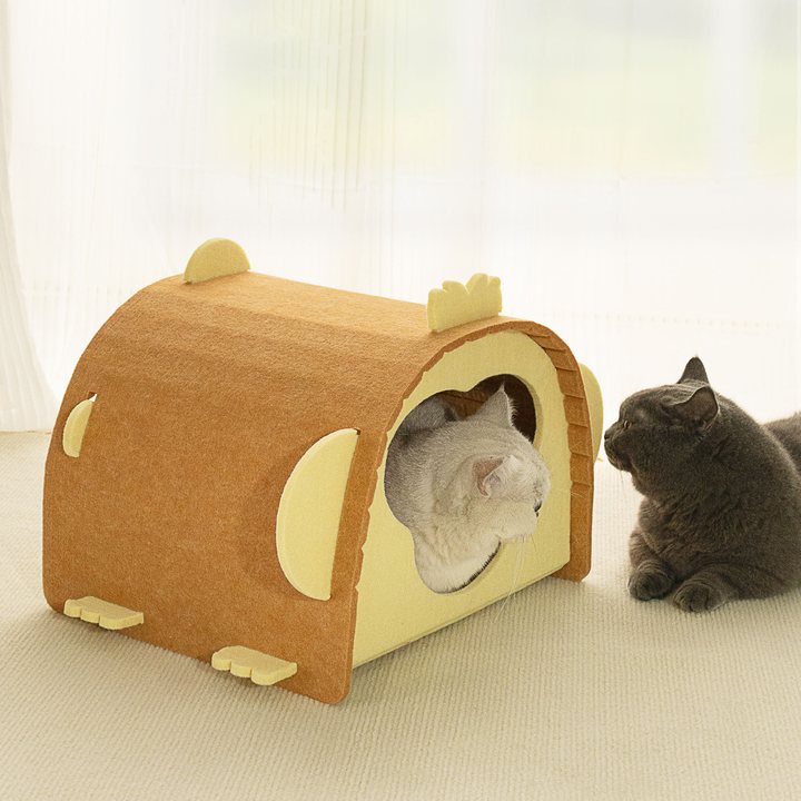 Arched felt cat cabin with a wood-grain print exterior and scalloped trim tabs, round side opening