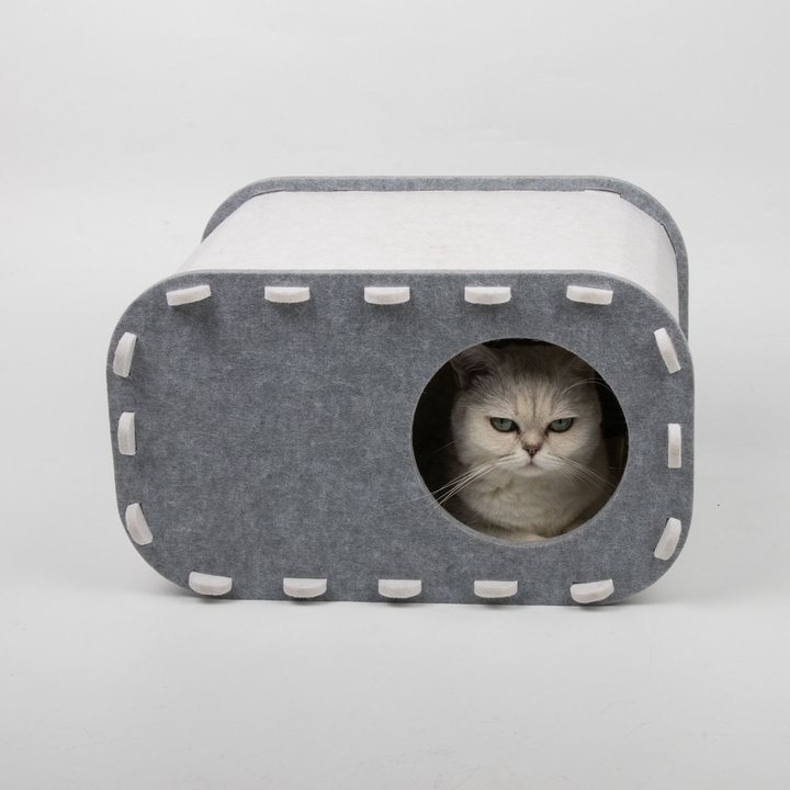 Gray felt cat house with a white top panel, stitched edge trim and a round doorway
