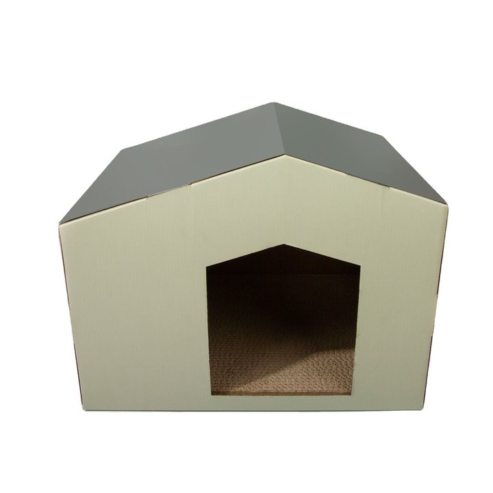 Pitched-roof cardboard cat house with cream walls, a gray gabled roof and a peaked doorway opening