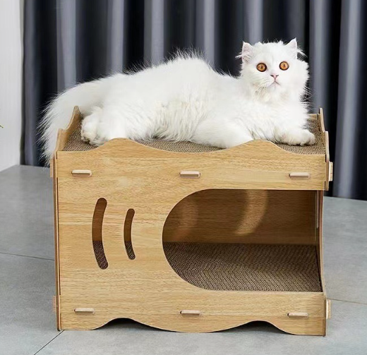 Two-tier tab-and-slot cat house with a rounded lower opening and corrugated floor panels; a cat lies on top.