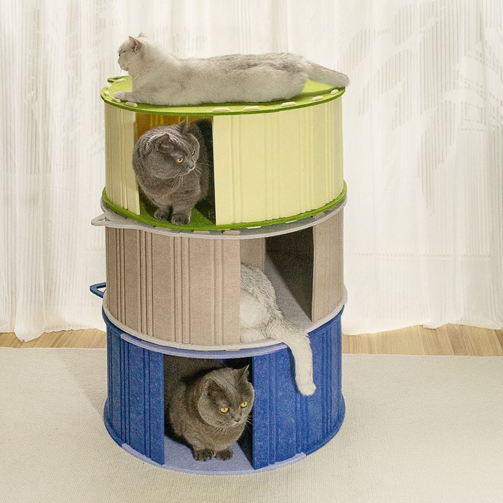 Three-tier round felt cat tower in green, tan, and blue with a cut-out entrance on each level.