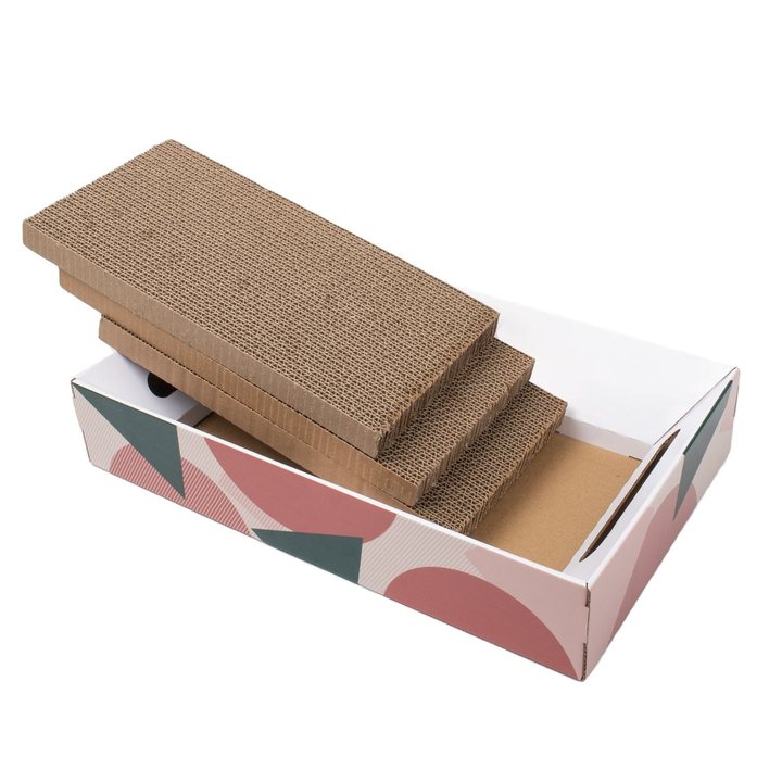 Rectangular corrugated cardboard cat scratcher box with a geometric triangle print, shown with replaceable scratch pads