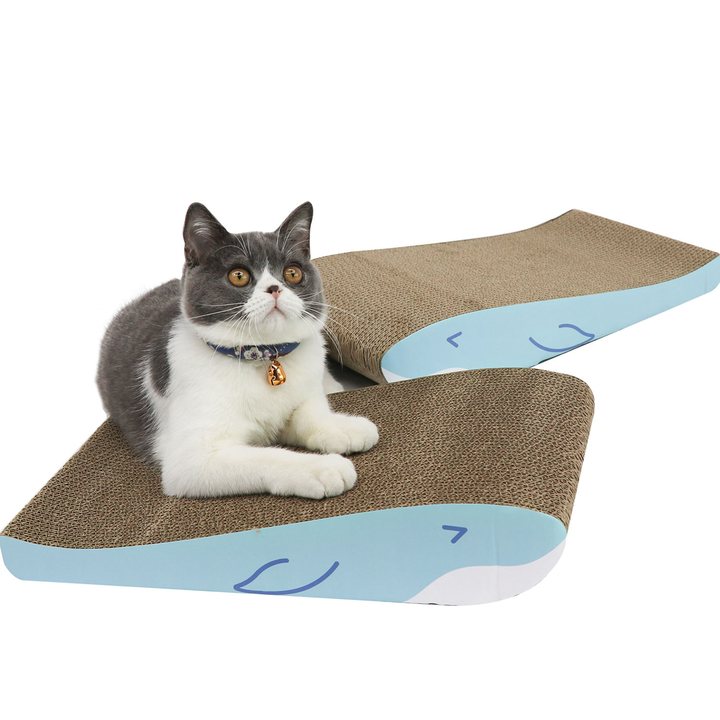 Blue and white whale-shaped corrugated cardboard cat scratchers shown together, each with a raised tail-shaped platform