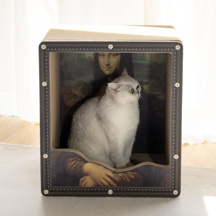 Black picture-frame-style cube cat scratcher box with a classical painting print and a natural cardboard scratch top