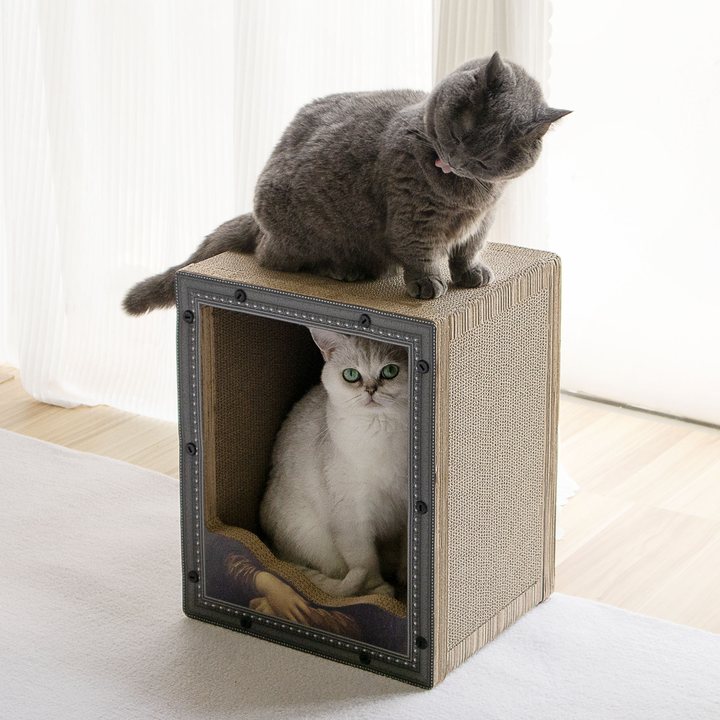 Two-tier black picture-frame-style cat scratcher tower with a classical painting print, shown with cats