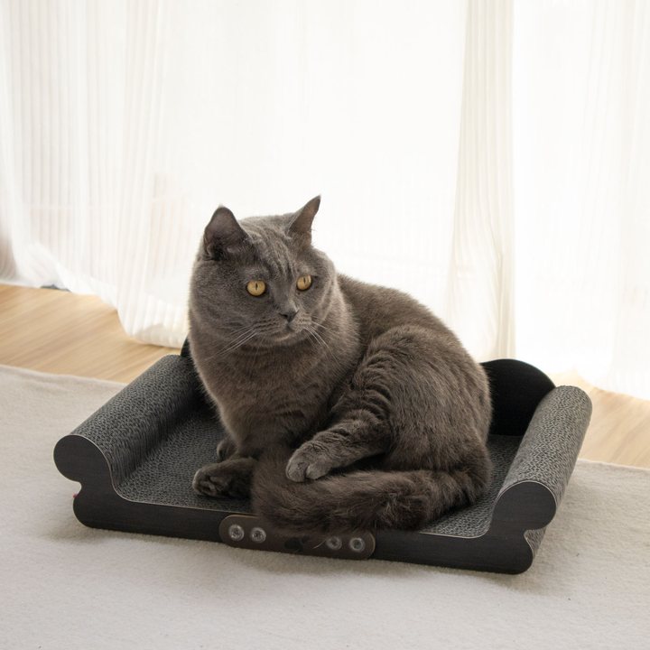 Scroll-arm corrugated cardboard cat scratcher lounge in dark charcoal.