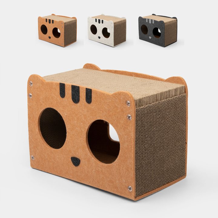 Cat-face shaped corrugated cardboard scratcher house with felt trim, two round entry holes, in orange, cream and dark grey