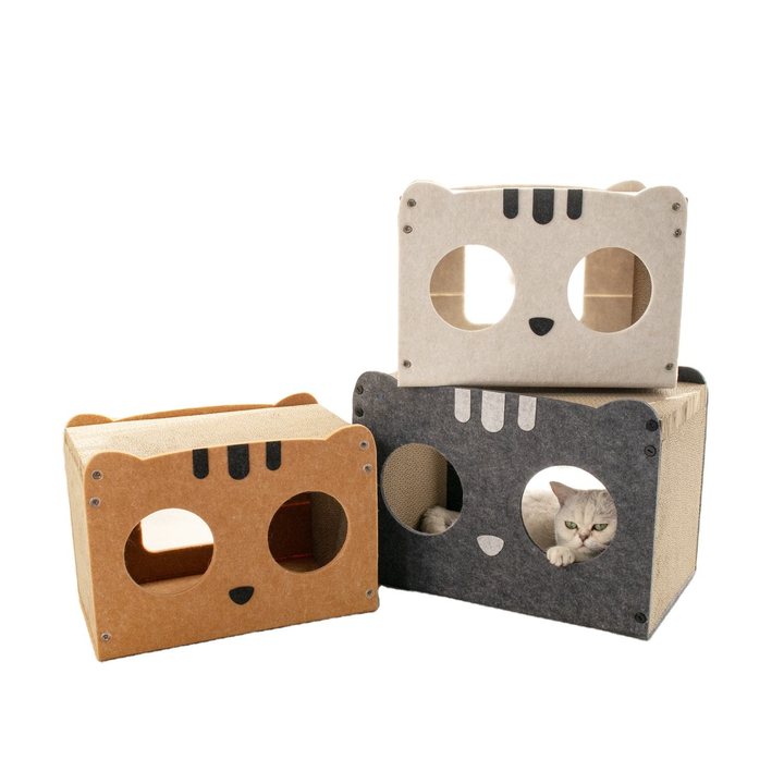 Cat-face shaped cardboard scratcher houses with felt trim in orange, cream and dark grey, each with two round openings