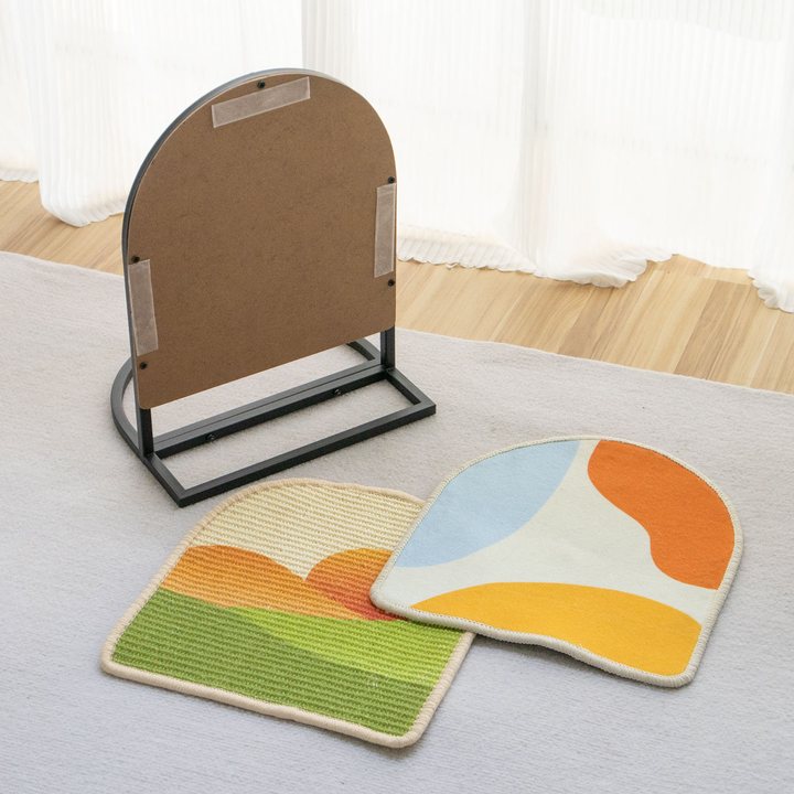 Arched cat scratch board metal stand shown with two interchangeable printed replacement scratch pads