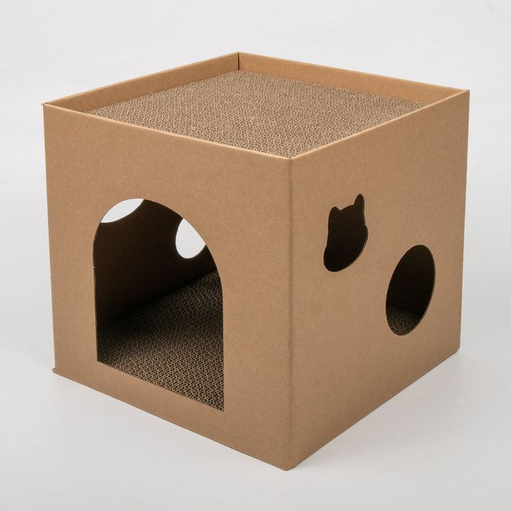 Cube-shaped kraft cardboard cat house scratcher with a cat-face cutout, round cutout and arched doorway