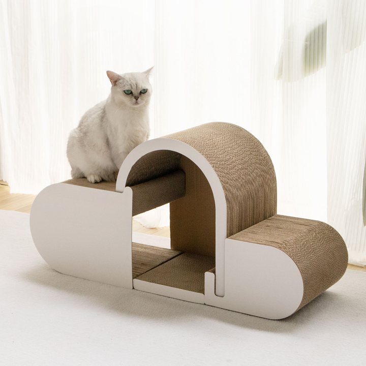Cream cloud-shaped cardboard cat house scratcher with an arched tunnel and two flat perch platforms.