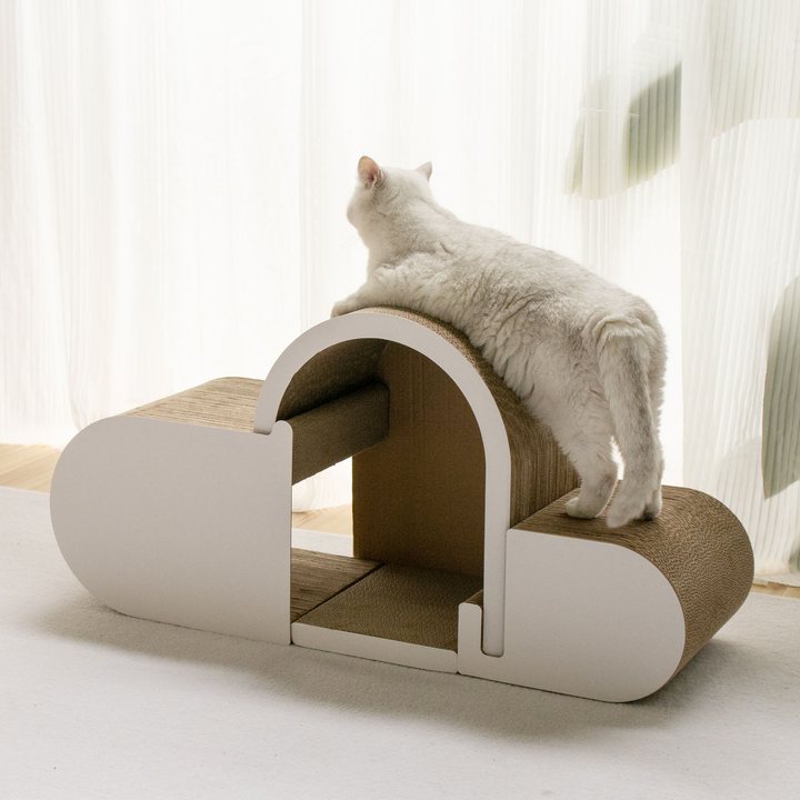 Cream cloud-shaped cardboard cat house scratcher with an arched tunnel and two flat perch platforms.