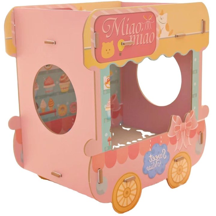 Pink and yellow cardboard cat house shaped like an ice-cream cart, with round window cut-outs and a bow accent