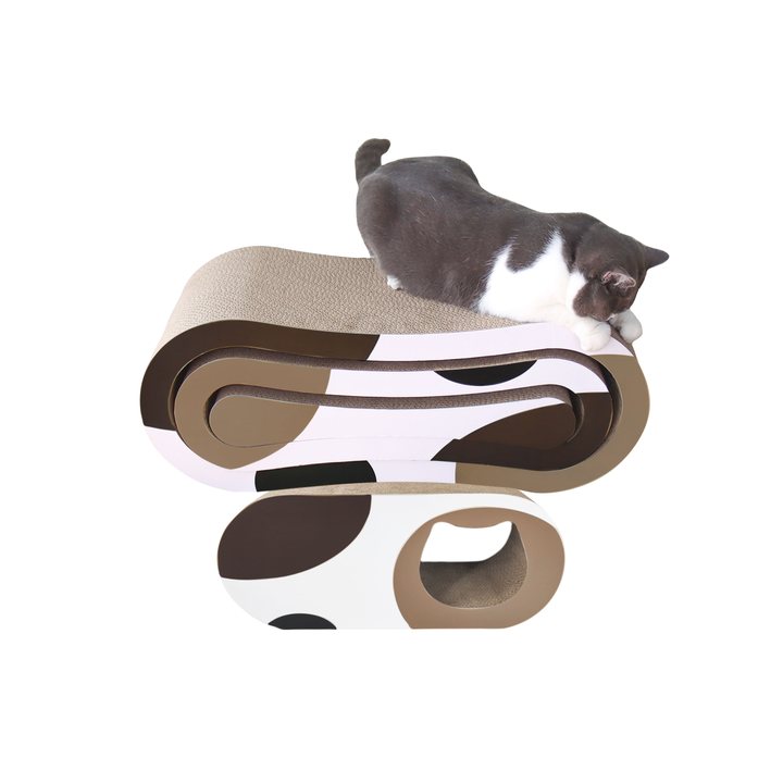 Wavy S-shaped cardboard cat scratcher lounge set in a cow-spot pattern, with a tunnel opening at one end