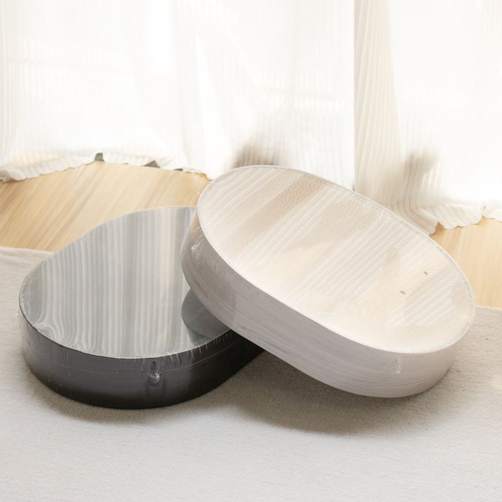 Two oval wood-grain patterned cat scratch pads, one in a dark finish and one in a light finish, shown leaning together.