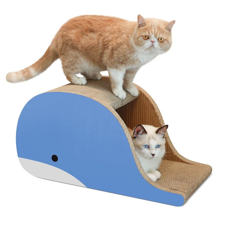 Blue and white whale-shaped corrugated cardboard cat scratcher with a raised platform and a tunnel opening